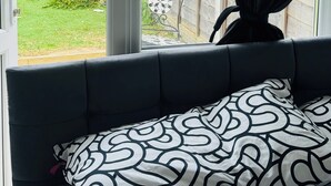 A room with a view of a wooden fence and garden. - Great family home to relax.
Within easy reach to London, Gatwick & Wimbledon . (Croydon)