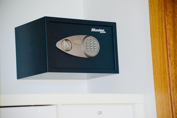 A black safe with a keypad and a keyhole, labeled "Master Lock."