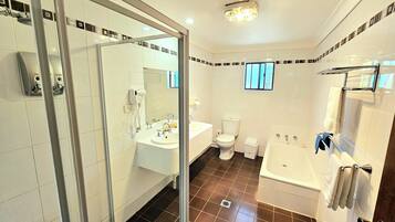Deluxe Two Bedroom Apartment | Bathroom | Shower, hair dryer, towels, soap