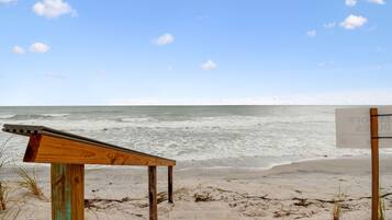 On the beach, sun loungers, beach towels
