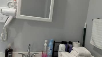 Hair dryer, towels, soap, shampoo