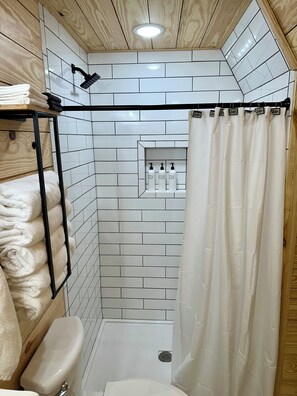Shower, hair dryer, towels, toilet paper