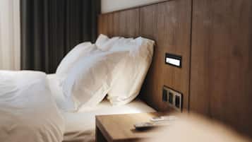 Premium bedding, down comforters, free minibar, desk