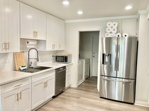 Fridge, microwave, oven, stovetop - Furnished modern organic 3-bed Townhome ★ South Coast Metro ★ Newly Remodeled ★ (Santa Ana)