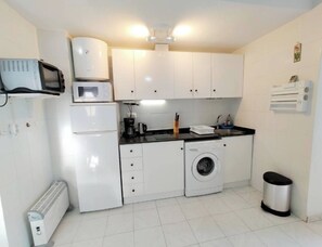 Fridge, microwave, oven, stovetop - Cozy Apartment 300 m from the Beach with Lake View, Wi-Fi & Air Conditioning (La Mata)