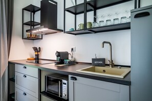 Fridge, microwave, stovetop, coffee/tea maker