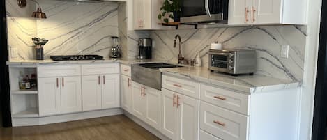 Fridge, microwave, stovetop, coffee/tea maker