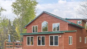 A two-story wooden cabin with a deck, surrounded by trees. - Minnesota lakefront home/cabin near Tower and Ely, close to Bear Head State Park (Ely)