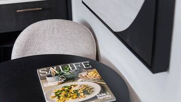 A magazine on a table with a black surface.