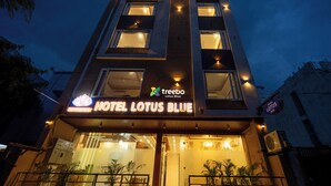 A modern hotel with a sign reading "Hotel Lotus Blue" and a logo for "trebo Lotus Blue". - Treebo Lotus Blue (Bhopal)