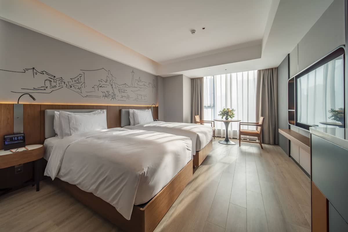 Free minibar items, in-room safe, laptop workspace, blackout curtains