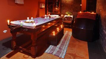 Experience relaxation with a soothing massage on our tranquil space, featuring a comfortable seating area and a serene ambiance.
