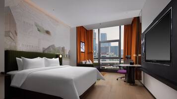 Deluxe Room | Free minibar, desk, blackout drapes, iron/ironing board
