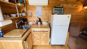 Fridge, coffee/tea maker, toaster, cookware/dishes/utensils