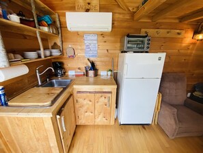 Fridge, coffee/tea maker, toaster, cookware/dishes/utensils