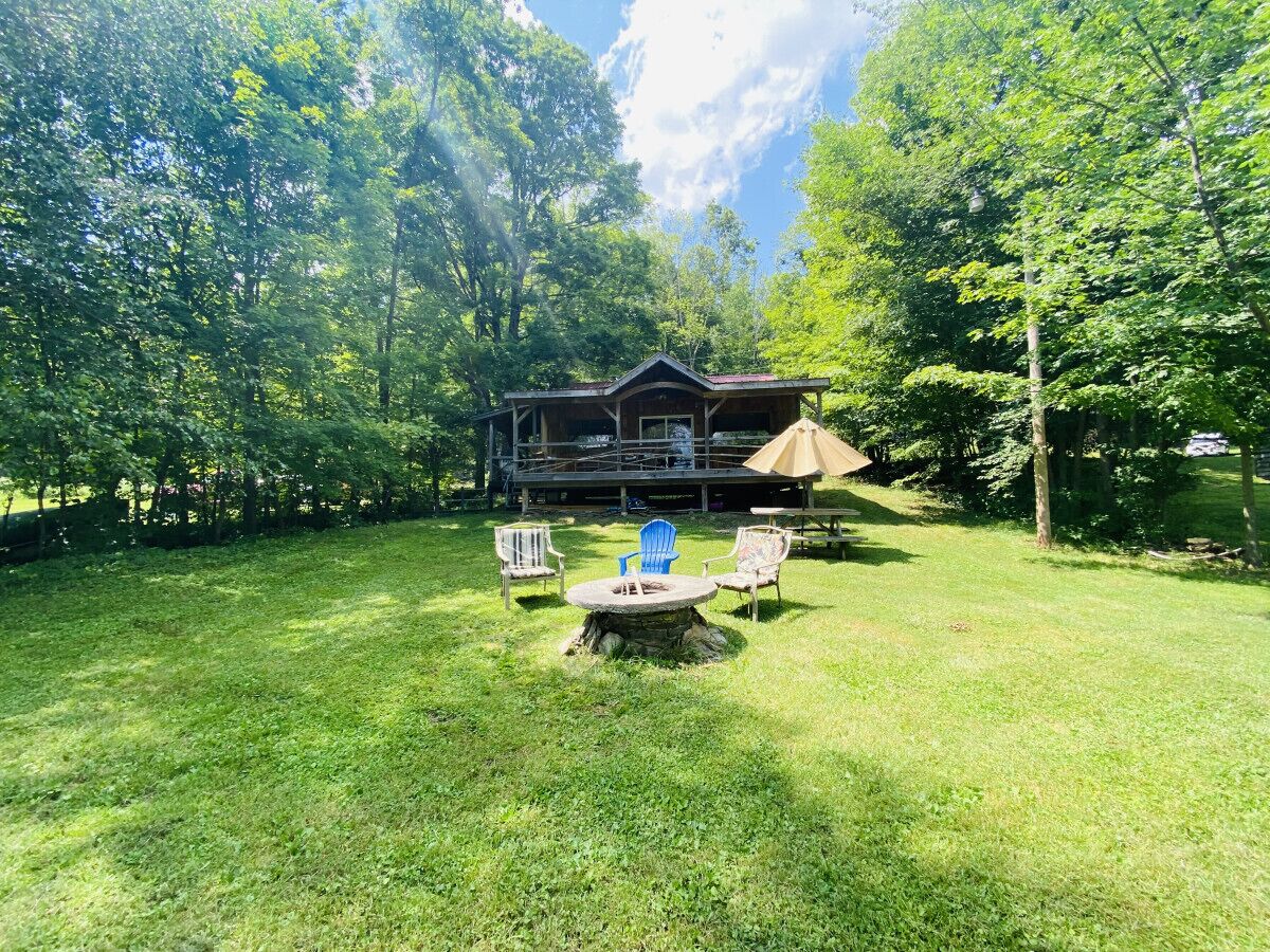 Savor stunning lake views from the porch, luxurious hot tub, cozy firepit, or manicured lawn. Enjoy the ideal backdrop for relaxation and unforgettable moments.