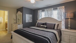 A bedroom with a bed, nightstand, dresser, and a ceiling fan. - It2852 - 5 Townhome in Storey Lake Resort, Sleeps Up To 10, Just 9 Miles To Disney (Kissimmee)