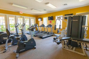 A gym with treadmills, elliptical machines, and Nautilus equipment. - Ihr11304ha - Solana Resort - 4 Bed 2 Baths Villa (Davenport)