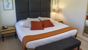 A neatly made bed with a brown throw blanket, a bedside lamp, and a remote control on a nightstand. - Ihr11318ha - Encantada Resort - 2 Bed 2.5 Baths Townhouse (Kissimmee)