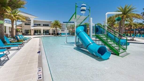 A swimming pool with a blue slide, lounge chairs, and palm trees. - Fs11379ha - Veranda Palms Resort - 6 Bed 4 Baths Villa (Kissimmee)