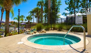 A hot tub surrounded by palm trees and a pool area with lounge chairs. - Ffv11400ha - Terra Verde Resort - 4 Bed 3 Baths Townhome (Kissimmee)
