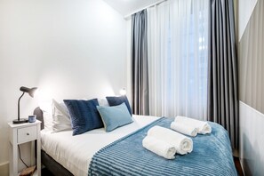 2 habitaciones, tabla de planchar con plancha y cuna de viaje 