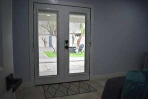 A double door with a view of a patio area.