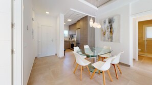 A modern kitchen with wooden cabinets and a built-in oven.