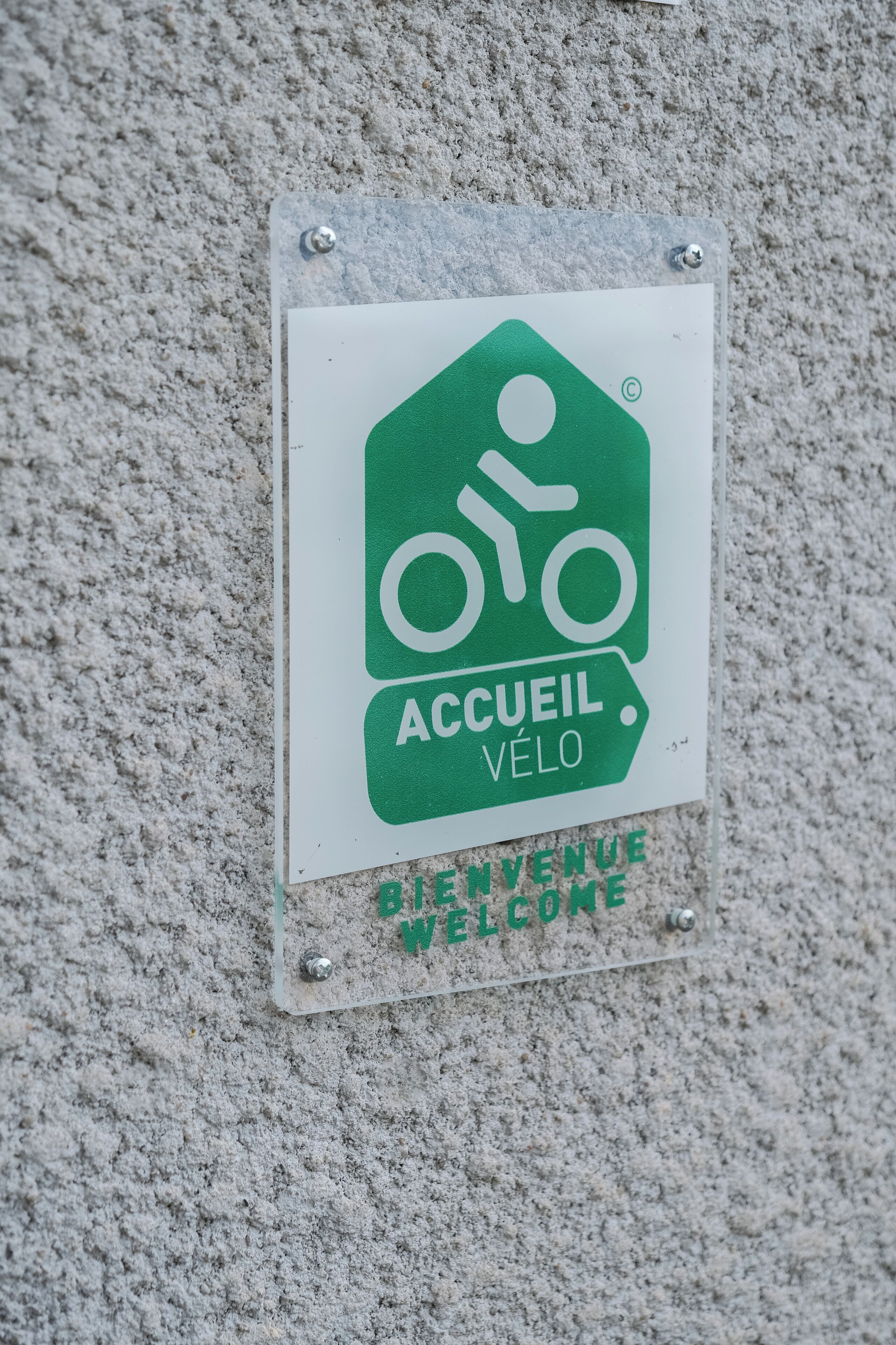 A welcome sign for a bicycle parking area.