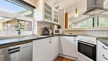 Fridge, stovetop, dishwasher, coffee/tea maker