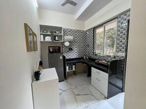 Fridge, microwave, oven, stovetop - Compact 2 Bedroom and 2 Bathroom with Balconies in Bandra West (Mumbai)