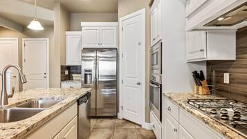 Townhome, 4 Bedrooms | Private kitchen | Fridge, oven, coffee/tea maker, toaster