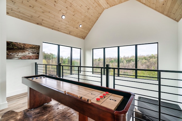 Shuffle board located on upper level overlooking living room.