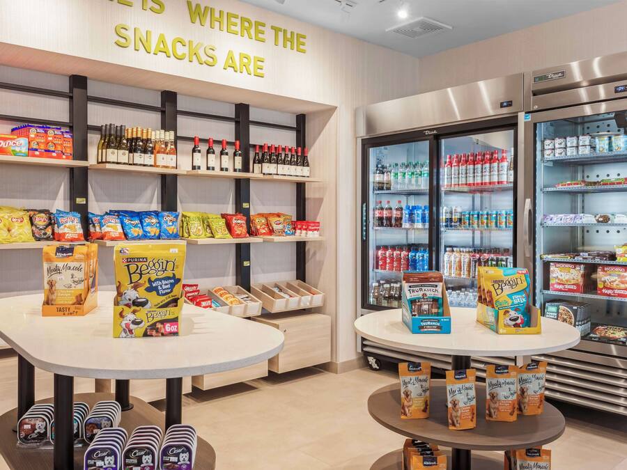 A snack display area with various packaged snacks and beverages.