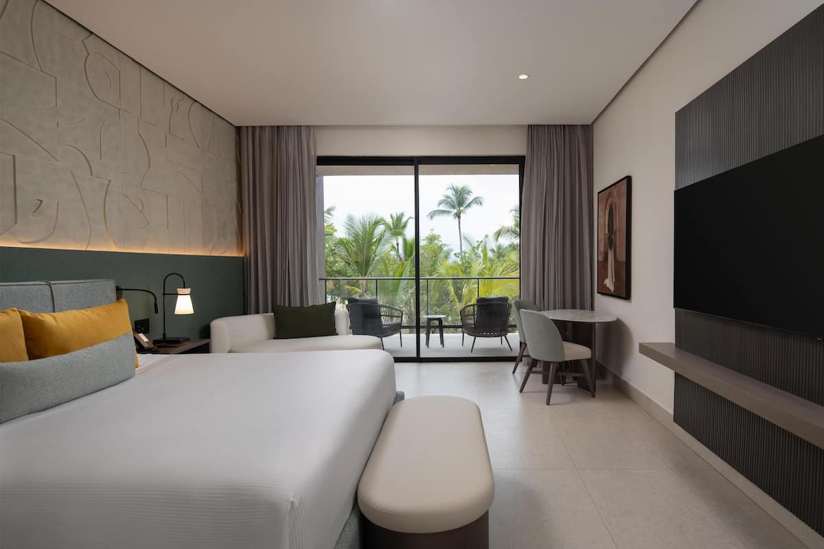 Room, 1 King Bed (Tropical View) | Living area | 50-inch Smart TV with digital channels