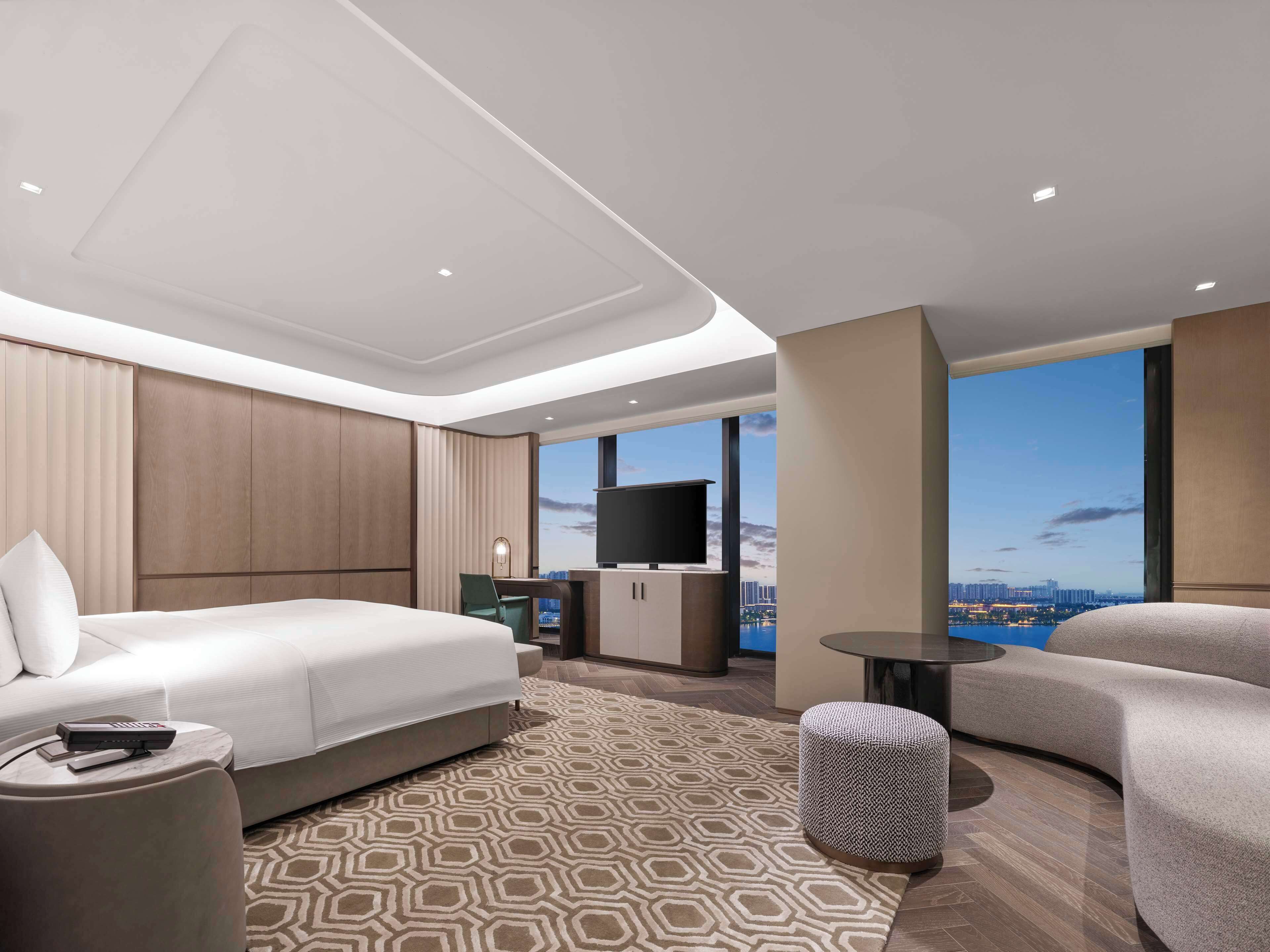 Deluxe Room, 1 King Bed | Living area | 65-inch TV with satellite channels