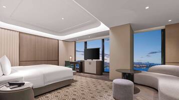 Deluxe Room, 1 King Bed | Living area | 65-inch TV with satellite channels