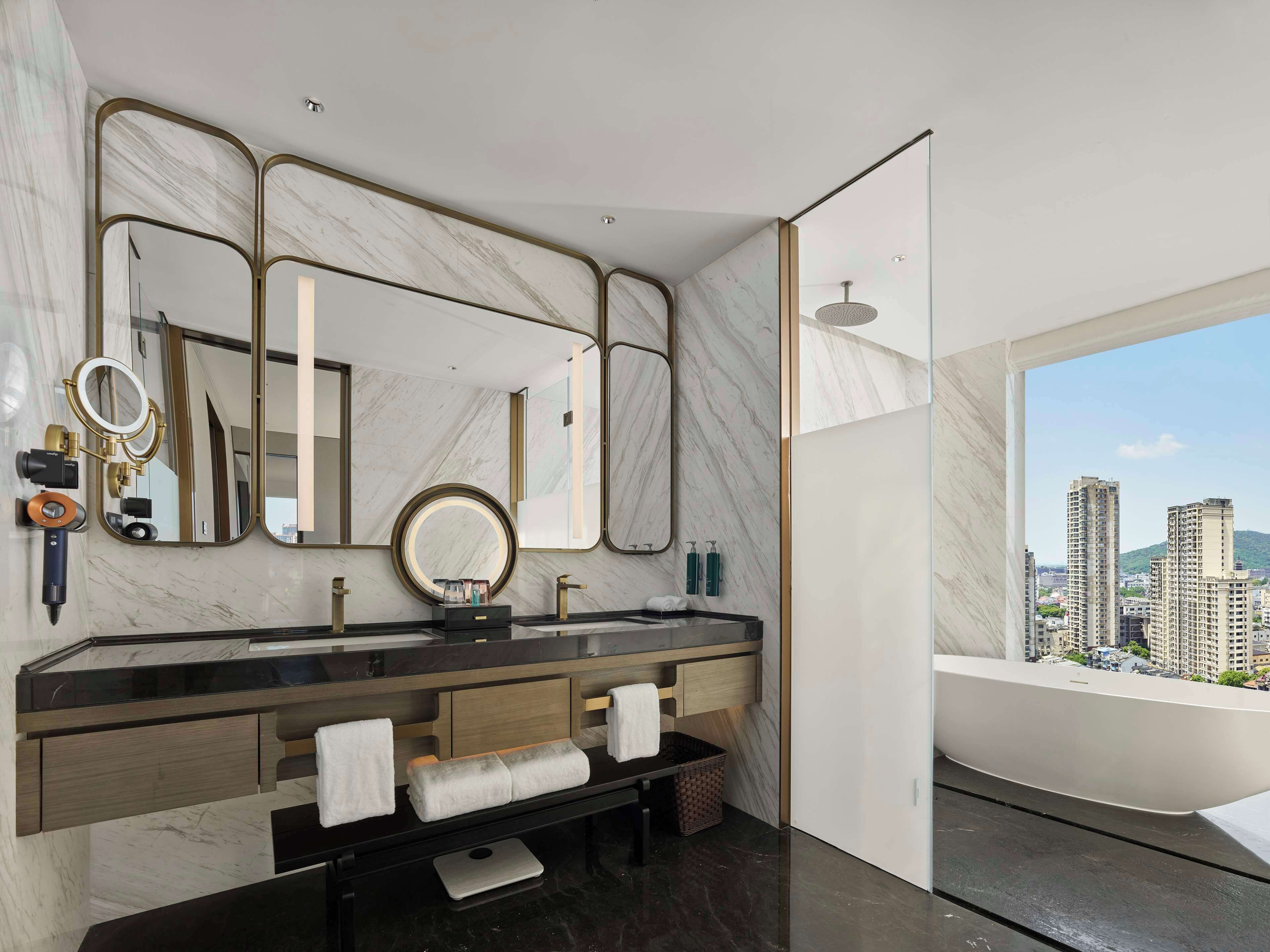Deluxe Suite, 1 King Bed | Bathroom | Rainfall showerhead, designer toiletries, hair dryer, bathrobes