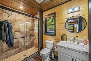 Shower, hair dryer, towels, toilet paper