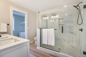 Shower, hair dryer, towels, toilet paper