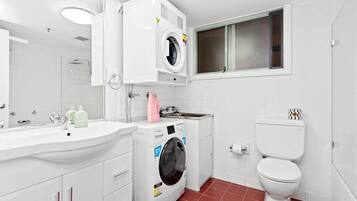 Shower, hair dryer, towels