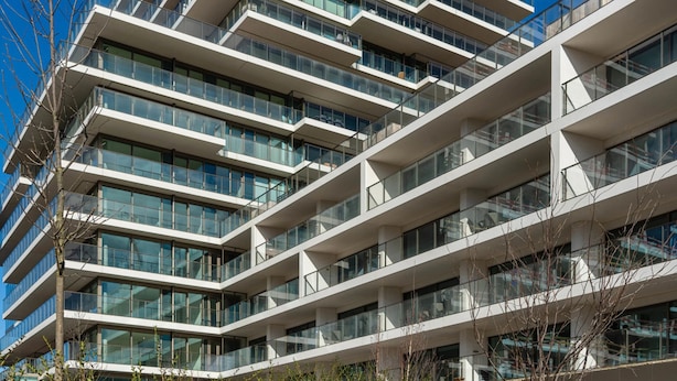 A modern multi-story building with balconies and large windows. - Casselbergh Residences Sky Bridge (Ostend)