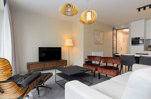 Deluxe Apartment, 2 Bedrooms, Patio, Courtyard View | Living area | 50-inch Smart TV with digital channels