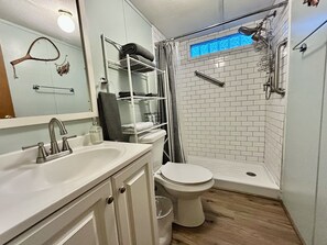 Shower, hair dryer, towels, soap