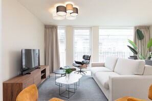 Deluxe Apartment, 2 Bedrooms, Kitchen, City View | Living area | 50-inch Smart TV with digital channels - Casselbergh Residences Kaaiman (Ostend)