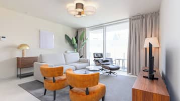 Deluxe Apartment, 2 Bedrooms, Balcony, City View | Living area | 43-inch Smart TV with digital channels