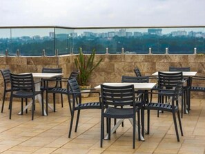 Enjoy a meal or meeting with a city view from this outdoor dining space.