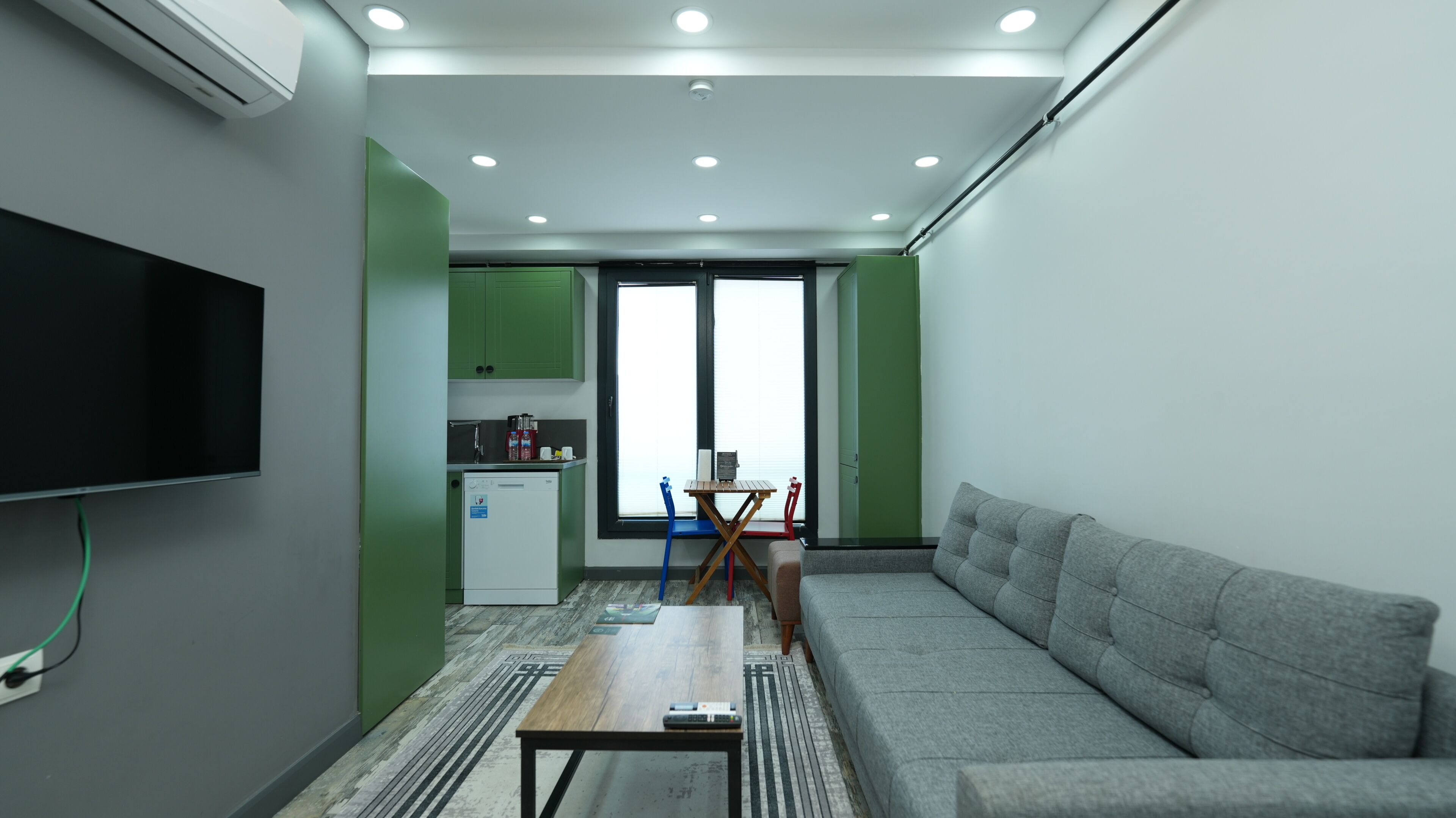 Suite Family Rooms | Living area | LCD TV, heated floors
