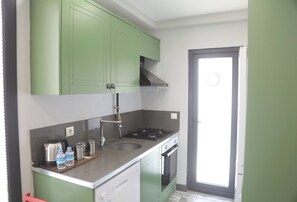 Apartemen | Dapur pribadi | Lemari es, oven, kompor, dan mesin pencuci piring