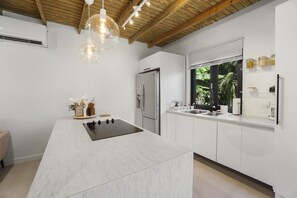 Fridge, microwave, stovetop, coffee/tea maker